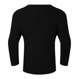 Detailed back view of a men's loose black waffle knit sweater with retro textured weave