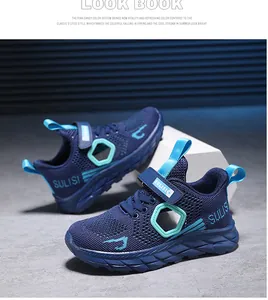 Detailed view of boys' blue mesh sneakers featuring breathable honeycomb cutouts and velcro strap