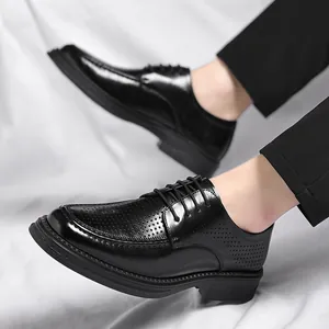 Black breathable men's business dress shoes with perforated details and soft sole