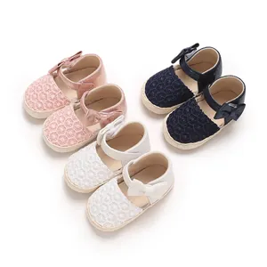 Group of cute baby girl soft-sole bow sandals shown in pink, navy blue, and white colors