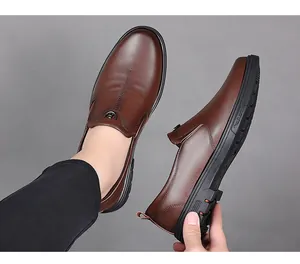 Detailed view of flexible rubber sole and soft brown leather on men's business shoes