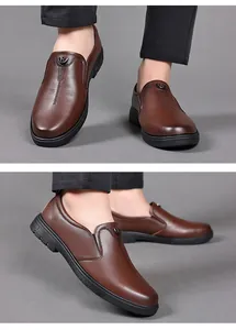 Detail view of men's brown genuine leather business casual loafers with metallic logo