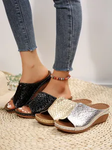 Stylish peep-toe wedge sandals featuring textured snakeskin patterns in three metallic colors