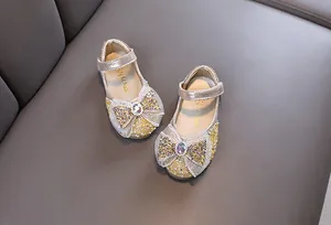 Χρυσά γυαλιστερά παπούτσια πριγκίπισσας για κορίτσια με φιόγκο από στρας