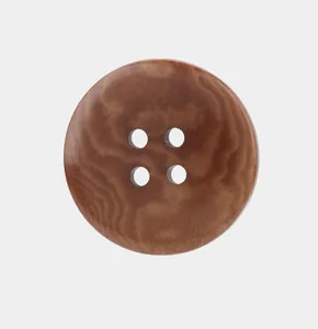 High-quality close-up of a brown 4-hole button made from South American palm nut