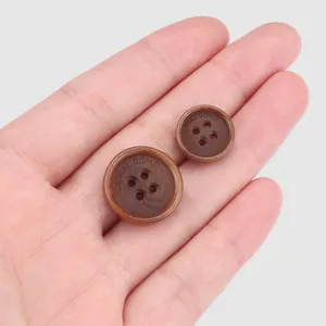 Sustainable dark brown corozo nut buttons with engraved casual uomo text for garments