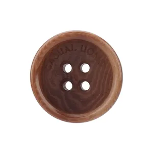Natural brown corozo nut button featuring four holes and engraved Casual Uomo brand text
