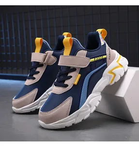 Close-up of lightweight children's sports shoes with navy blue and yellow accents