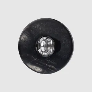Natural black mother of pearl shell button with silver shank for dresses and coats.