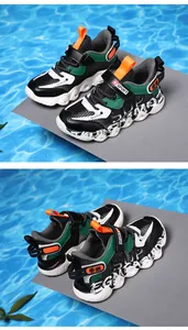 Detailed view of breathable mesh sneakers for boys featuring a colorful sporty design.