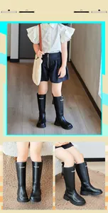 Gros plan de bottes hautes noires pour filles avec texte mode et fermeture éclair