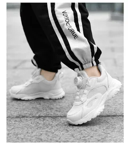 Detailed view of breathable white mesh sneakers for kids with convenient rotary buckle
