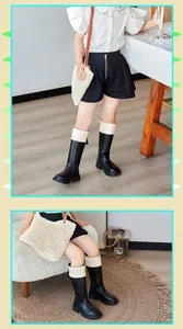 Stylish black and cream children's knight boots with a functional back zipper detail