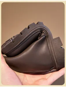 Detail view showing the highly flexible sole of children's brown leather Martin boots.