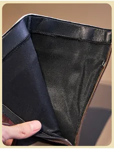 Close-up of mesh lining and back zipper detail on black children's boots