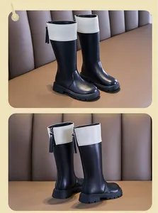 Side and back view of children's black and white leather boots with back zipper