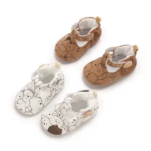 Detail of cartoon bear print baby soft sole pre-walker shoes in brown and white