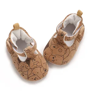 Brown corduroy baby soft-sole Mary Jane shoes featuring a cute cartoon bear print pattern