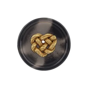 Elegant dark gray resin suit button featuring a golden knotted heart center ornament