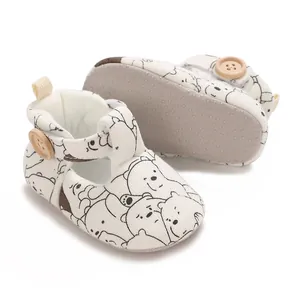 Detailed view of baby princess shoes with cartoon bear print and soft non-slip sole