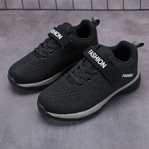 Breathable black fly-knit mesh sneakers for boys with adjustable velcro strap
