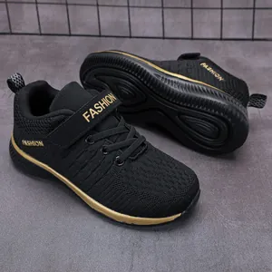 Boys' black breathable mesh sneakers with gold trim and velcro strap for running