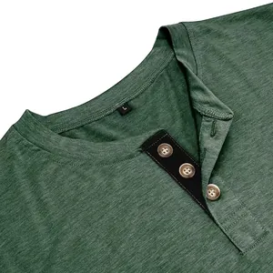 Detail view of a green men's slim fit Henley shirt with contrast black button placket