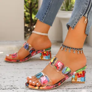 Stylish bohemian chunky mid-heel slippers featuring colorful gems and transparent double straps