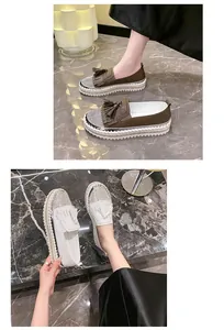 Detail of women's rhinestone platform loafers with tassels and stylish thick soles