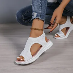 Close-up of white breathable mesh sports sandals with thick sole for women, 2025