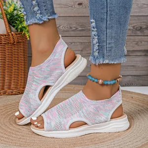 Macro detail of multi-colored knit mesh upper on casual women's peep-toe platform sandals.