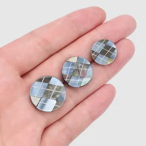 Detail view of premium Japanese imported round shell buttons with mosaic grid pattern