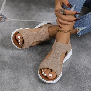 Stylish beige knit mesh platform sandals for women in a casual lifestyle setting.