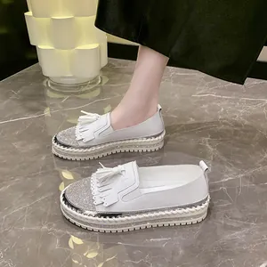 Chic white platform loafers for women with tassel fringe and rhinestone toe details