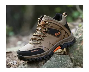 Detailed side view of durable khaki high-top hiking boots with rugged outdoor traction