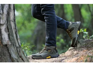 Detailed side view of durable high-top hiking boots in a forest setting