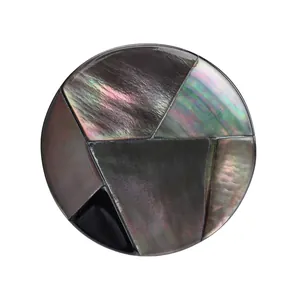 Luxury round black mother-of-pearl shell button with iridescent patchwork for coats