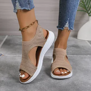 Close-up of beige mesh platform sandals with white thick soles for women footwear