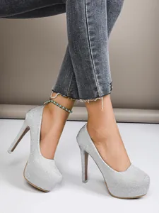 Detail shot of silver glitter platform high heels featuring a 16cm sexy thin stiletto heel