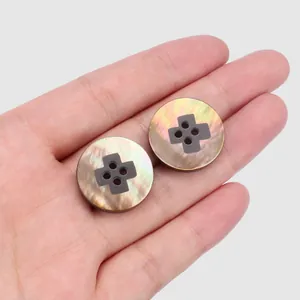 Close-up of premium decorative mother of pearl shell buttons for luxury coats and garments