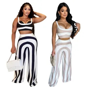 Elegante conjunto casual de dos piezas para mujer con top corto a rayas y pantalón ancho