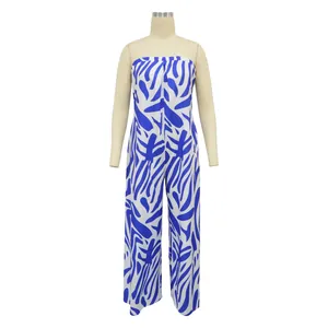 Close-up detail of the vibrant blue and white abstract floral print on a wide-leg jumpsuit.