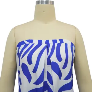Detailed view of blue and white abstract print on a strapless tube top jumpsuit