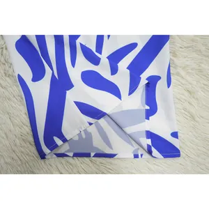 Detailed view of the hem stitching on a blue and white printed wide-leg jumpsuit