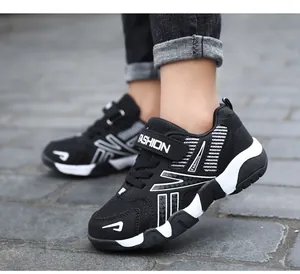 Close-up detail of boys breathable black mesh running sneakers with lightweight soft sole