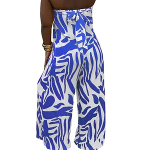 Detail view of the back tie design on a blue and white patterned strapless wide leg jumpsuit