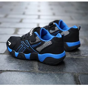 Side view of breathable black and blue kids' running shoes with a mesh upper design.