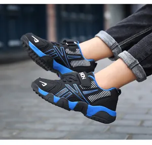 Close-up action shot of blue and black breathable mesh sneakers for boys on city pavement