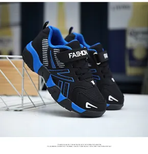 Close-up detail of breathable mesh upper and secure strap on kids running shoes