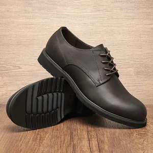 Detail view of dark brown men's genuine leather dress shoes with anti-slip sole.